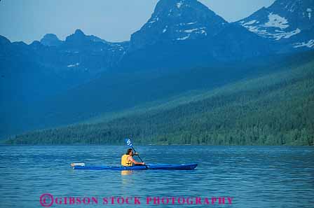 Stock Photo #12899: keywords -  boat boating exercise exercises exercising glacier horz kayak kayaker kayaking kayaks lake landscape landscapes man mcdonald montana mountain mountains national nature paddle park parks public recreation rocky scenery scenic solitude sport sports water wilderness