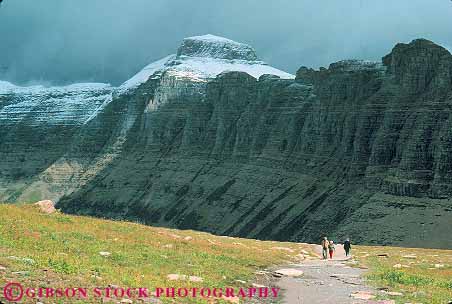 Stock Photo #12906: keywords -  explore exploring glacier hike hiker hikers hiking horz landscape landscapes logan montana mountain mountains national nature near park parks pass path people public rocky route scenery scenic trail walk walking wilderness