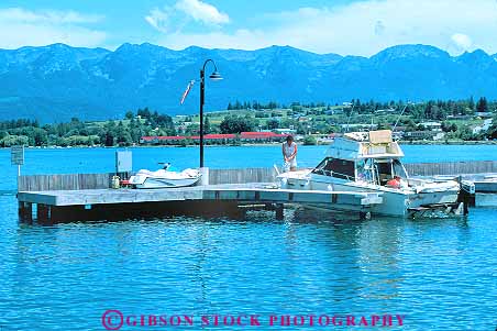 Stock Photo #18551: keywords -  boat boating boats flathead horz lake lakes marina marinas montana mountain people person polson recreation region rocky state summer vacation water