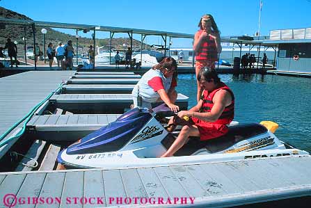 Stock Photo #12917: keywords -  area boat boating boats colorado couple couples destination dock docks fresh horz lake lakes las marina marinas mead national near nevada recreation rents reservoir river rivers skido summer travel vacation vegas water waverunner west western young