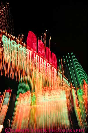 Stock Photo #12100: keywords -  abstract abstraction abstracts blur blurred bright color colorful dark destination evening exposure gambling lighting lights long motion movement moving neon nevada night of panning reno sign signs streak streaked streaks tracks travel vert