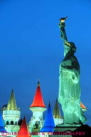 Stock Photo #8119: keywords -  architecture bright casino casinos color colorful dark destination dusk evening hotel hotels las lighting lights neon nevada new night resort resorts statue travel usa vacation vegas vert york