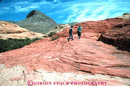 Stock Photo #8237: keywords -  area canyon conservation couple desert destination explore exploring geologic geology hike hiker hikers hiking horz landscape las man national nature near nevada pair recreation red redrock rock sandstone scenery scenic travel vegas walk walking