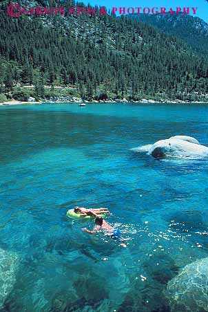 Stock Photo #12941: keywords -  alpine child children clean clear father float floating floats fresh kid kids lake lakes leisure mountain mountains nevada parent park play playing pristine resort resorts sierra sierras single state swim swimmer swimming swims tahoe vacation vert water with