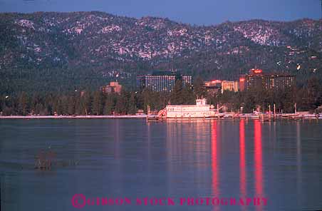 Stock Photo #12945: keywords -  alpine boat boats dark dusk evening fresh horz lake lakes landscape lighting lights mountain mountains nevada paddlewheel queen reflect reflection reflects resort resorts scenery scenic shore sierra sierras south sunset tahoe water