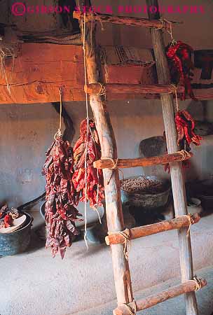 Stock Photo #12964: keywords -  chili hacienda hanging historic history inside interior ladder ladders martinez mexico mountains new old pepper peppers rocky site taos tradition traditional vert vintage west western wood wooden