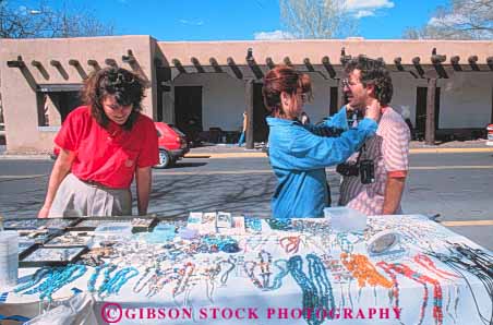 Stock Photo #8966: keywords - business buyer buyers buying buys couple couples craft crafts destination fe handmade horz jewelry mexico mountain mountains new retail rocky sante sidewalk silver southwest summer tourist tourists travel traveler travelers turquoise vendor west western