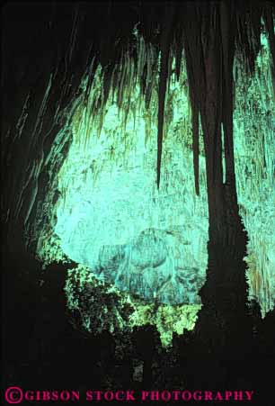 Stock Photo #9907: keywords -  calcium carbonate carlsbad cave cavern caverns caves column dark deposit depositing deposition deposits dissolution dissolve dissolved dissolving dripstone earth erode eroded erodes eroding erosion flowstone formation formations geologic geological geology ground hollow hollowed lighting limestone mexico national new park parks rock science sedimentary stalactite stalactites stalagmite stalagmites vert