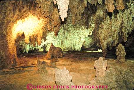 Stock Photo #9913: keywords - calcium carbonate carlsbad cave cavern caverns caves dark deposit depositing deposition deposits dissolution dissolve dissolved dissolving dripstone earth erode eroded erodes eroding erosion flowstone formation formations geologic geological geology ground hollow hollowed horz lighting limestone mexico national new park parks rock science sedimentary stalactite stalactites stalagmite stalagmites