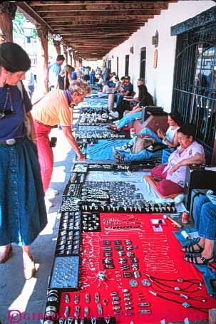 Stock Photo #11105: keywords -  albuquerque american business buy buyer buyers buying casual craft crafts customer display displaying displays handcrafted handicraft handmade indian jewelry mexico native new old outdoor outside retail sales sell seller sellers selling sidewalk silver small southwest town turquoise urban vendor vendors vert west women