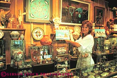 Stock Photo #11108: keywords -  albuquerque art artistic display displayed displaying displays gallery handcrafted handicraft handmade horz in merchandise mexico new painting penfield retail sell seller selling sells southwest urban west woman