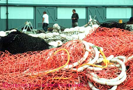 Stock Photo #10279: keywords - and boats cities city coast coastal equipment fish fishermen fishing gear horz net nets northwest ocean people puget sea seashore seattle shore shoreline sound tackle washington water waterfront wharf wharfs work working