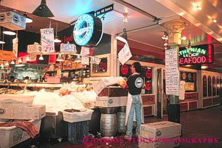Stock Photo #10283: keywords -  business cities city display fish food horz interior job jobs man market markets merchandise northwest pike pikes produce retail seattle sell selling store stores unpacks washington work worker workers working works