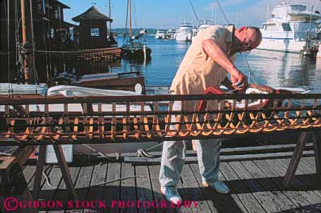 Stock Photo #10337: keywords -  boat boating boats center citizen club clubs dock docks elderly frame handicraft handmade heritage horz kayak making man marina marinas marine maritime mature northwest old retired seattle senior umiak washington wood wooden