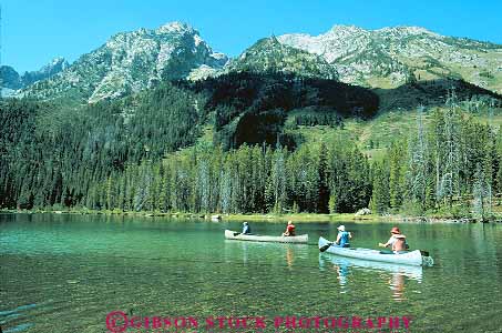 Stock Photo #12046: keywords -  boat boaters boating canoe canoeing canoers canoes grand horz jenny lake lakes landscape landscapes mountain mountains national paddle paddling park parks people recreation rocky scenery scenic teton west western wyoming