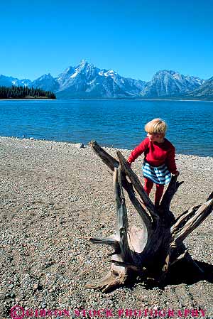 Stock Photo #12047: keywords -  climb climbing girl girls grand jackson lake lakes landscape landscapes mountain mountains national outdoor outside park parks released rocky scenery scenic stump teton tree vert west western wyoming youth
