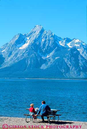 Stock Photo #12048: keywords -  child daughter grand jackson lake lakes landscape landscapes mother mountain mountains national outdoor outside parent park parks picnic picnics released rocky scenery scenic single teton vert west western woman wyoming