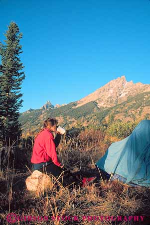 Stock Photo #12995: keywords -  alpine camp camper camping camps drink drinking drinks environment grand habitat landscape mountain mountains national natural nature outdoor outside park parks public relax relaxes relaxing released rocky scenery scenic site tent teton tetons vert west western woman women wyoming
