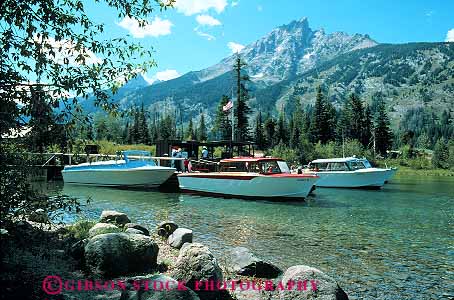 Stock Photo #13004: keywords -  alpine boat boats environment grand habitat horz jenny lake lakes landscape motorboats mountain mountains national natural nature outdoor outside park parks public rocky scenery scenic summer teton tetons tour tours west western wyoming