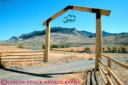 Stock Photo #18655: keywords - arch arches beam cody entrance fence fences gate gates horz landscape log logs rach ranch ranches scenery scenic timber west western wood wooden wyoming