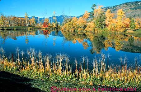 Stock Photo #13006: keywords -  alpine autumn color destination fall foliage hole horz jackson lake lakes landscape mountain mountains outdoor outside pond ponds rocky scenery scenic summer tetons tourist town towns travel west western wyoming yellow