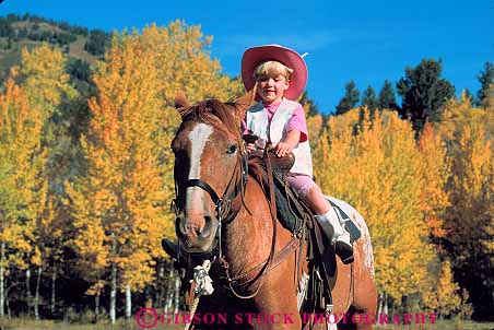 Stock Photo #13008: keywords -  alpine aspen autumn child color destination fall foliage girl hat hole horse horseback horses horz jackson mountain mountains outdoor outside released ride rider riding rocky summer tetons tourist town towns travel west western wyoming