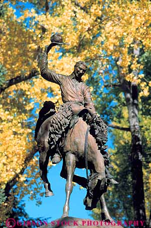 Stock Photo #13009: keywords -  alpine autumn color cowboy destination fall foliage hole in jackson metal mountain mountains outdoor outside rocky sculpture square statue statues summer tetons tourist town towns travel vert west western wyoming