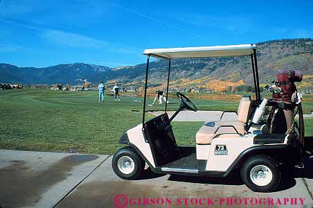 Stock Photo #13017: keywords -  alpine cart carts course destination golf golfers golfing hole horz jackson men mountain mountains outdoor outside pines recreation resort resorts rocky sport sports summer teton tetons tourist town towns travel west western wyoming
