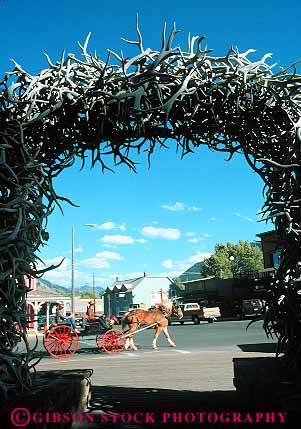 Stock Photo #13019: keywords -  alpine antler antlers arch arches carriage carriages destination elk gate gates hole horse horses jackson mountain mountains near outdoor outside resort rocky summer tetons tour tourist tourists tours town towns travel vert west western wyoming