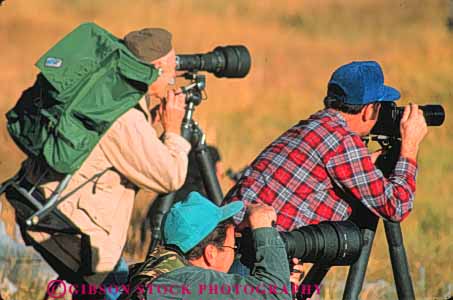 Stock Photo #10989: keywords -  activity camera cameras class equipment group groups hobby horz man men national outdoor outside park parks people photograph photographer photographers photographic photographing photography public recreation skill usa wildlife wyoming yellowstone