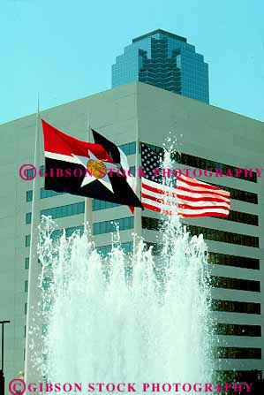 Stock Photo #11831: keywords - american cities city cityscape dallas downtown flag flags fountain fountains splash spray state texas three vert water