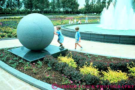 Stock Photo #11838: keywords - ball balls botanical boy boys center child children dallas fountain fountains garden gardens horz in outdoor outside recreation rock round shape shapes sphere spheres spherical stone texas youth