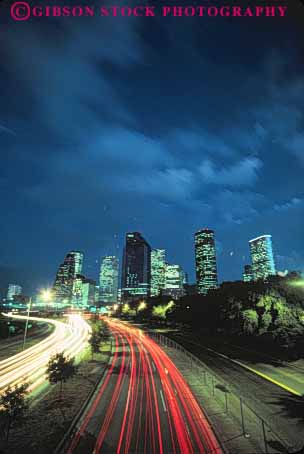 Stock Photo #7558: keywords -  america american architecture blur building buildings business center cities city cityscape cityscapes dark downtown dusk evening houston light lighting lights modern motion move movement moving new night office skyline skylines streak texas traffic urban usa vert west