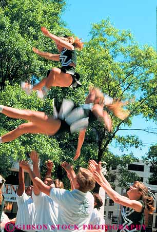 Stock Photo #11900: keywords - action america blur blurred careful catch caution cheerleader cheerleaders college coordinate coordinated coordinates coordinating fall falling female gathering houston lift lifting lifts male men motion movement moving student students team texas throw thrown toss tossing unison unity vert walk women