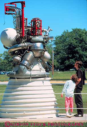 Stock Photo #13043: keywords -  center display displaying displays engine engines equipment exhibit exhibits exploration houston johnson look museum museums people rocket rockets science space technology texas vert