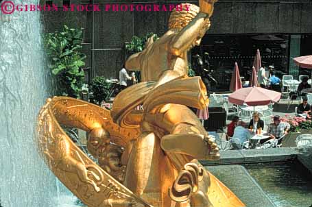 Stock Photo #9081: keywords - cafe cafes center city courtyard dine dining downtown gold golden horz mall new outdoor outside park plaza plazas rockefeller sculpture sculptures statuary statue summer york