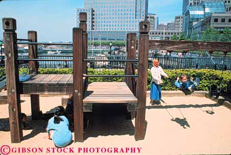Stock Photo #9105: keywords -  city downtown esplanade horz new play playground relax relaxing swing wood wooden york