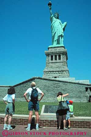 Stock Photo #9114: keywords -  attraction city families family famous gift green landmark liberty metal new of people statue statues steel summer symbol symbolic symbolize symbolizes tall tourist tourists traveler travelers vert visit visitors york