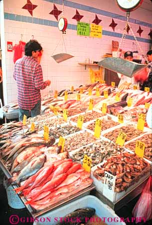 Stock Photo #9126: keywords -  asian business buy buyer buying buys chinatown chinatowns chinese city community display ethnic fish food fresh in market markets merchandise minority new retail seafood sell seller selling sells small store stores vert york