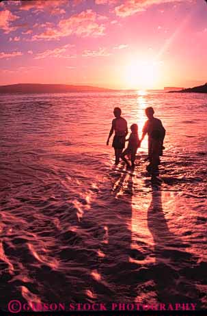 Stock Photo #8614: keywords -  beach beaches child children close coast coastal destination families family hands hawaii hawaiian hold husband island islands man marine maritime oahu ocean people released resort resorts sea seashore seawater shallow share shore shoreline silhouette silhouettes spouse stroll sunset sunsets surf together tourists travel travelers tropical usa vacation vert walk walkers walking walks warm water wife woman