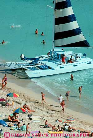 Stock Photo #13053: keywords -  beach beaches boat boats catamaran catamarans destination hawaii hawaiian island islands leisure oahu recreation sail sailboat sand tour touring tours travel tropical vacation vert waikiki water