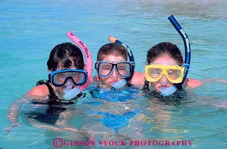 Stock Photo #13055: keywords - children destination diving girl girls hawaii hawaiian horz island islands leisure mask oahu playing recreation released snorkel snorkeling snorkels sport three travel tropical vacation waikiki water