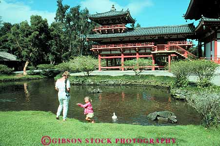 Stock Photo #13084: keywords -  buddhist building byodo child church churches daughter destination girl hawaii hawaiian horz in islands mother oahu parent parents pond religious single temple temples tourist travel tropical vacation