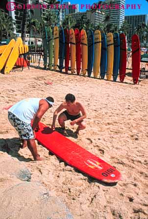 Stock Photo #8617: keywords -  beach beaches coast coastal destination equipment hawaii hawaiian island islands man marine maritime oahu ocean play rent rents resort resorts sea seashore seawater shore shoreline sport surf surfboard travel tropical usa vacation vert waikiki water