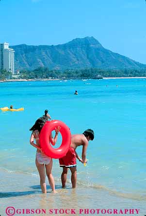 Stock Photo #11733: keywords -  asian beach coast coastal couple destination ethnic hawaii oahu ocean recreation resort resorts sand shore shoreline travel tropical vacation vert waikiki