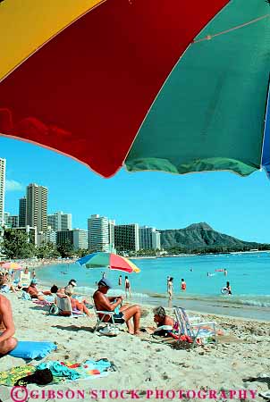 Stock Photo #11736: keywords - beach coast coastal destination hawaii oahu ocean recreation resort resorts sand shore shoreline sunbath sunbathers sunbathing travel tropical umbrella vacation vert waikiki