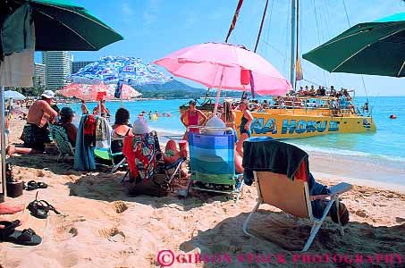 Stock Photo #11737: keywords - beach coast coastal destination hawaii horz oahu ocean recreation resort resorts sand shore shoreline sunbath sunbathers sunbathing travel tropical umbrella vacation waikiki
