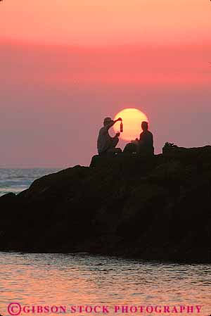 Stock Photo #11739: keywords - alone beach bottle calm coast coastal couple dark destination dusk evening hawaii oahu ocean peaceful privacy private quiet recreation resort resorts shore shoreline silhouette silhouettes solitary solitude sunset sunsets travel tropical vacation vert waikiki wine