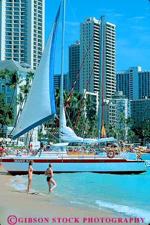 Stock Photo #11742: keywords -  beach boat boats catamaran coast coastal colorful destination hawaii oahu ocean recreation resort resorts sailboat sailboats shore shoreline tour travel tropical vacation vert waikiki
