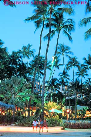 Stock Photo #11743: keywords - beach dark destination dusk evening hawaii hilton hotel lighting lights night oahu recreation resort resorts travel tropical vacation vert waikiki